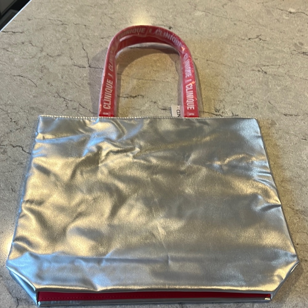 Silver Clinique bag NWT